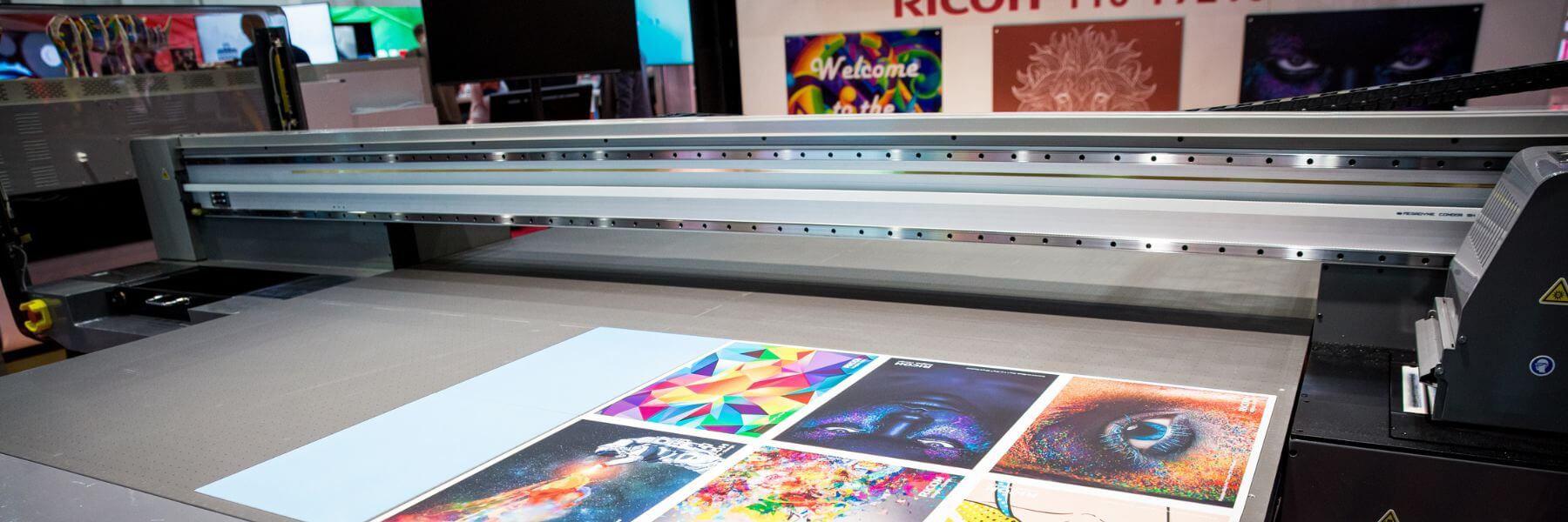 Ricoh wide format printer with colorful prints on top
