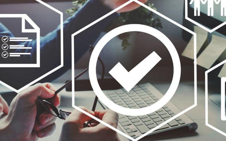 icons over person at keyboard: check mark, people, documents