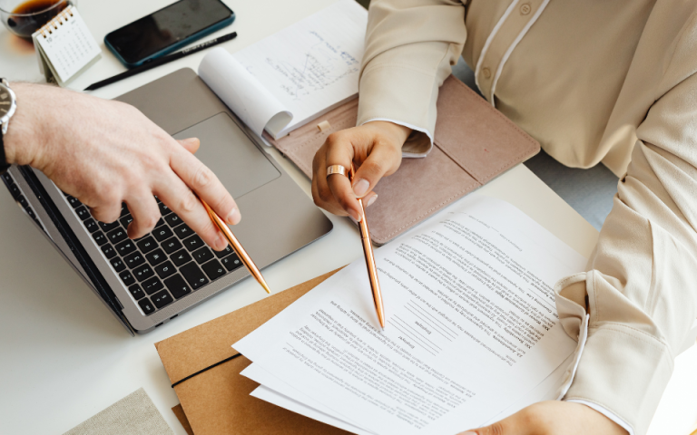 people reviewing a printed document