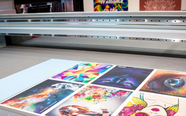 colorful prints on top of a Ricoh wide format printer