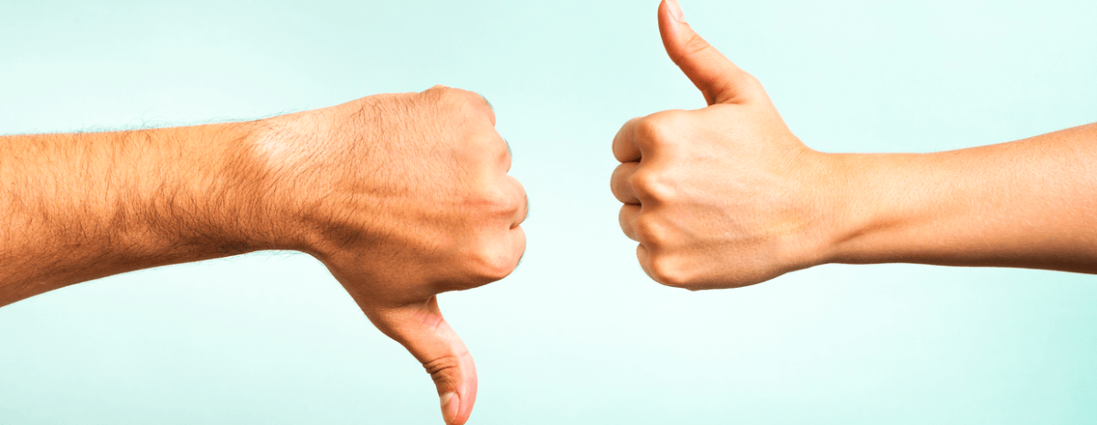 Thumbs up and down on a blue background 