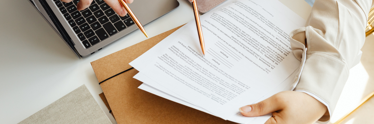 people looking at printed document