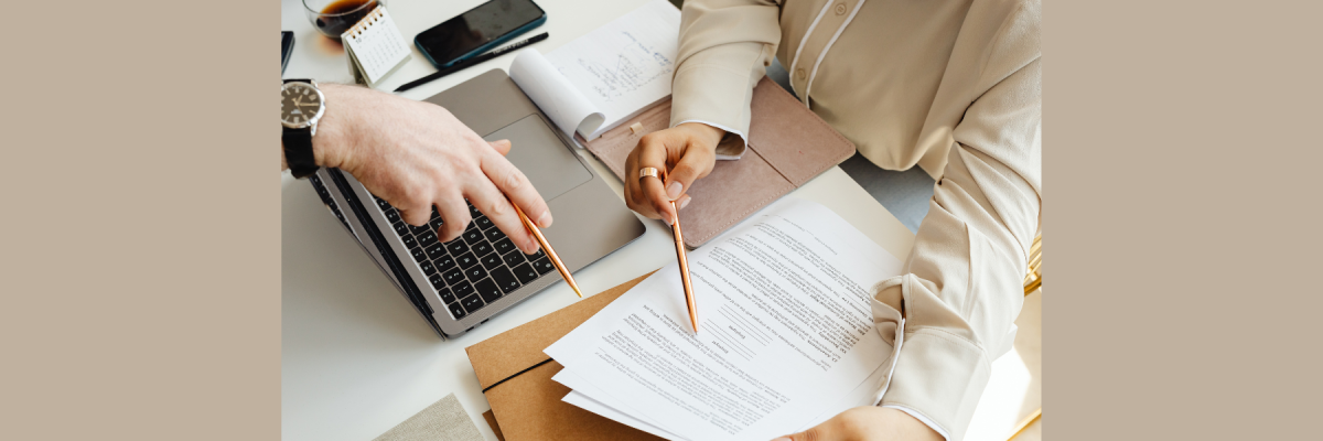 people reviewing a printed document