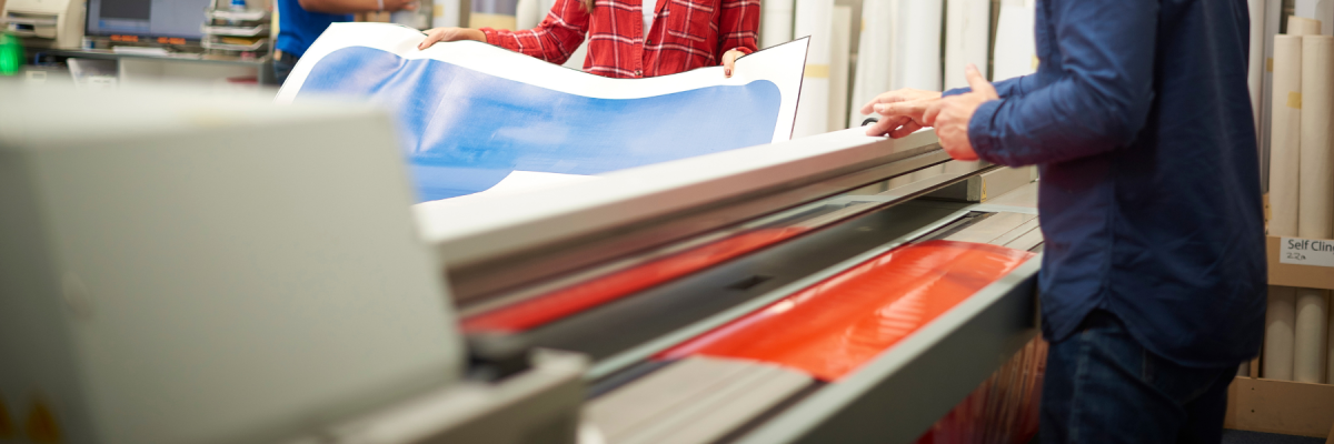 people printing large signs