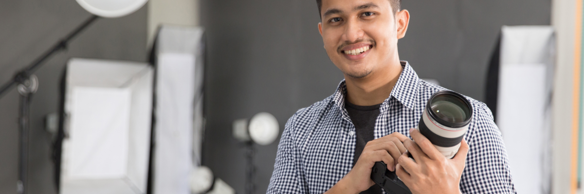 photographer holding camera